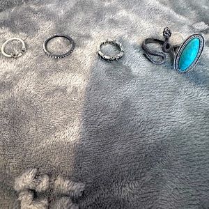 Assorted silver tone and turquoise rings